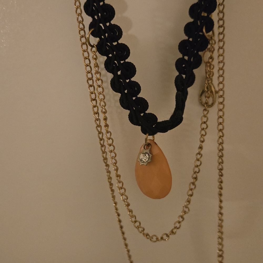 Elegant Black and Gold Necklace with Orange Pendant